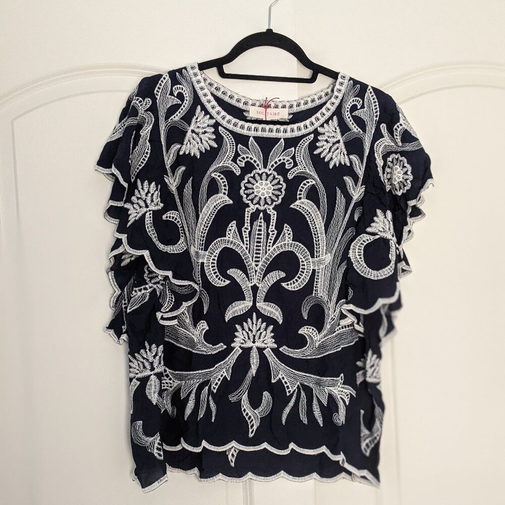 NWT Navy flutter sleeve blouse with contrast embroidery